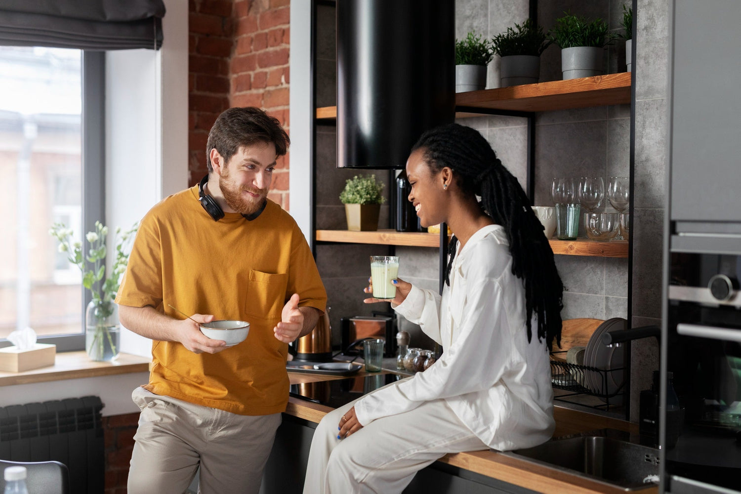 Cozy couple making coffee together in a sunny kitchen, soft smiles and undivided attention