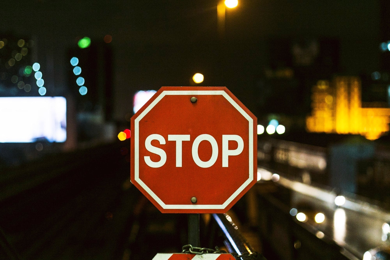 close up of a stop sign at dusk on a quiet street,
